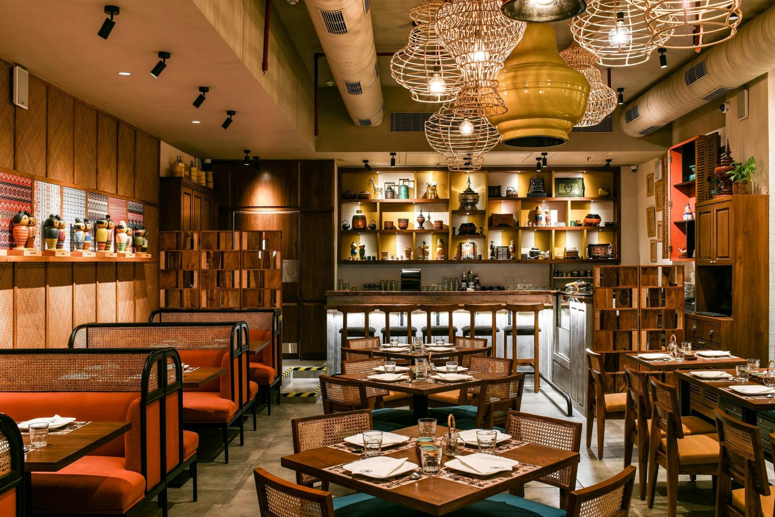 Cozy restaurant interior with ambient lighting and elegant table setting for an inviting dining experience.